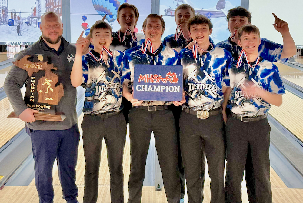 The Durand boys bowling team celebrates its Finals championship.