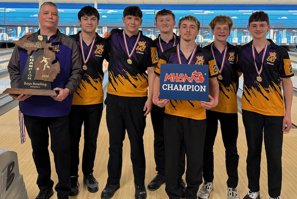 The Blissfield boys bowling team poses for a photo with its Division 4 championship trophy.