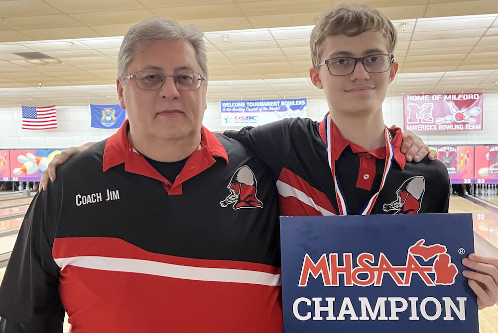 Devin Patrick, right, poses for a photo with Lake Shore coach Jim DeLong after Patrick won the Division 2 title.