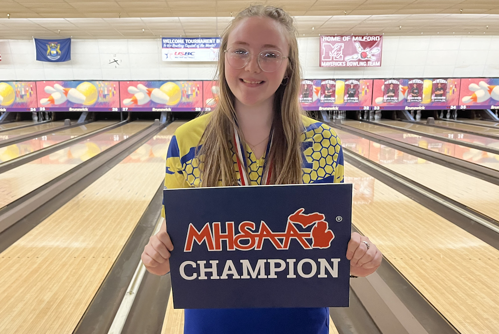 Noel Bunch poses for a photo after winning the Division 2 singles title.