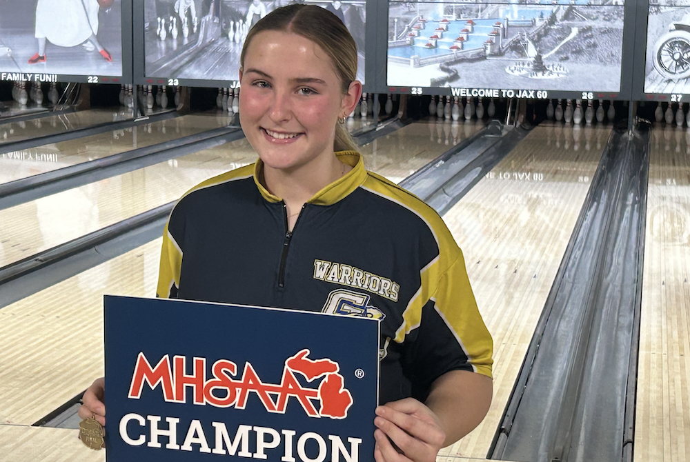 Grass Lake's Marielle Schafran poses for a photo after winning the Division 3 singles title.