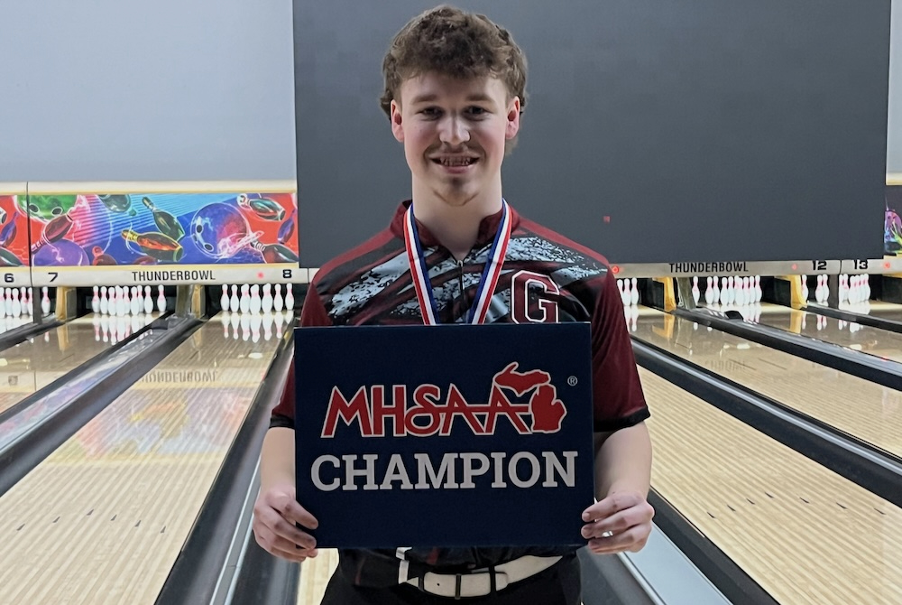 Grandville's Ethan Brown poses for a photo after winning the Division 1 title.