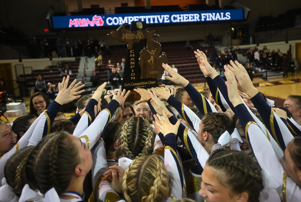 Rochester Hills Stoney Creek raises its latest championship trophy Friday at CMU.