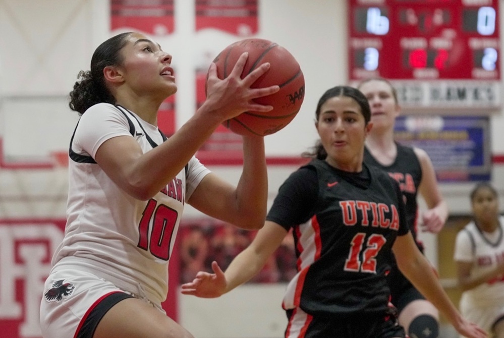 Port Huron’s Mariah Turner (10) goes to the basket against Utica this season. 