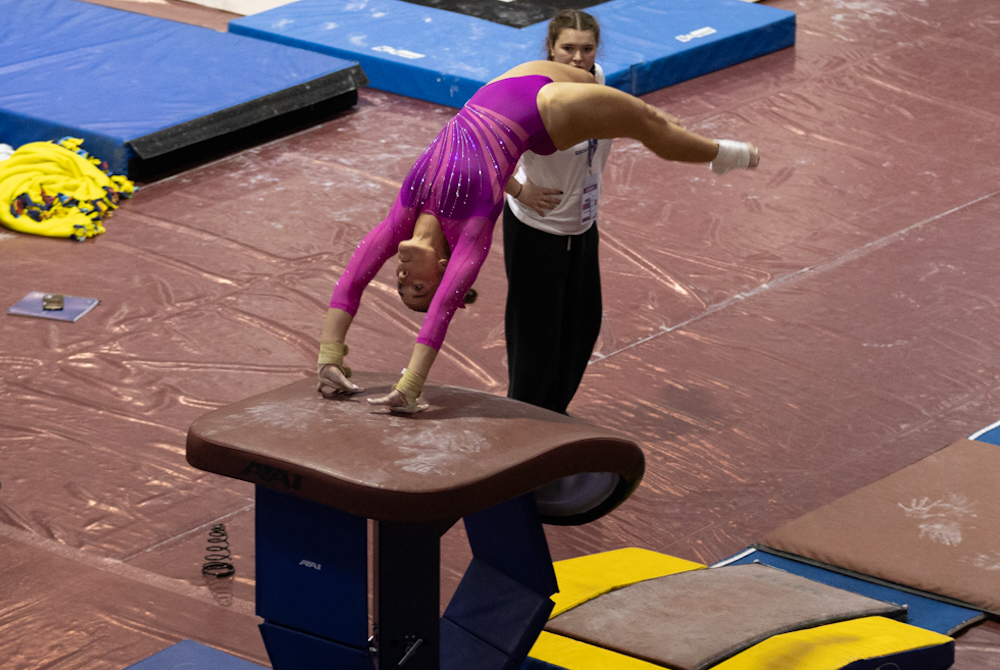 Hartland’s Alexis Fundich vaults during Saturday’s Individual Finals at Milford. 