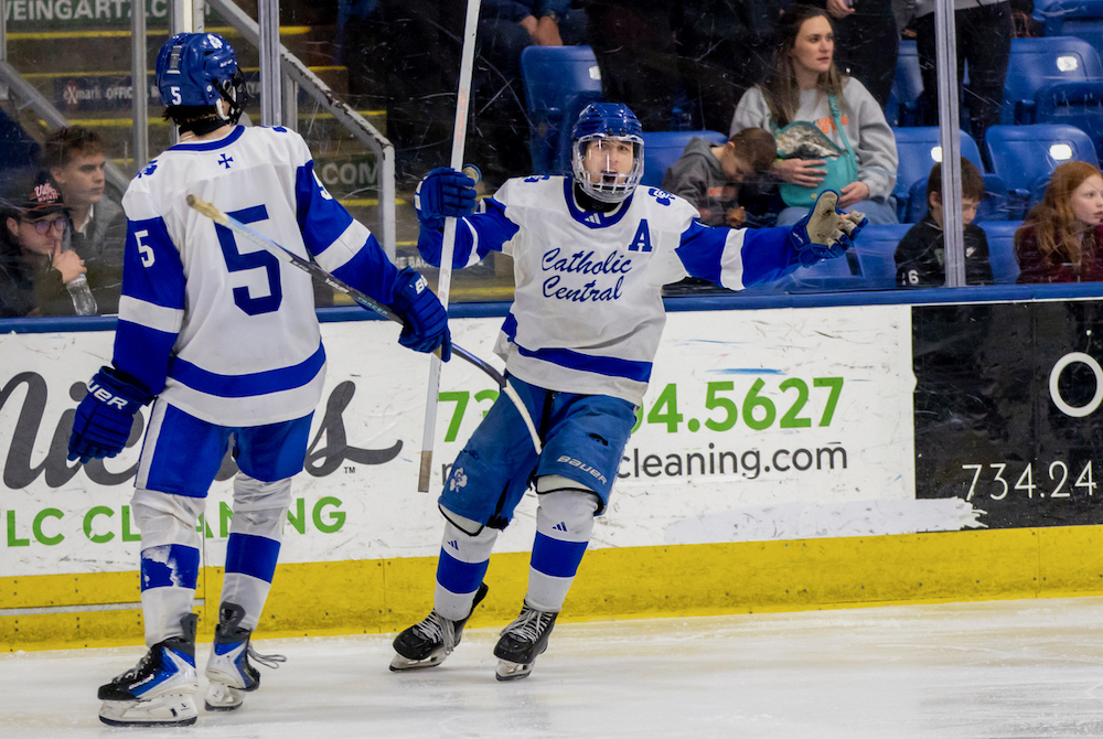 Detroit Catholic Central players celebrate during their Division 1 Final win Saturday and USA Hockey Arena.