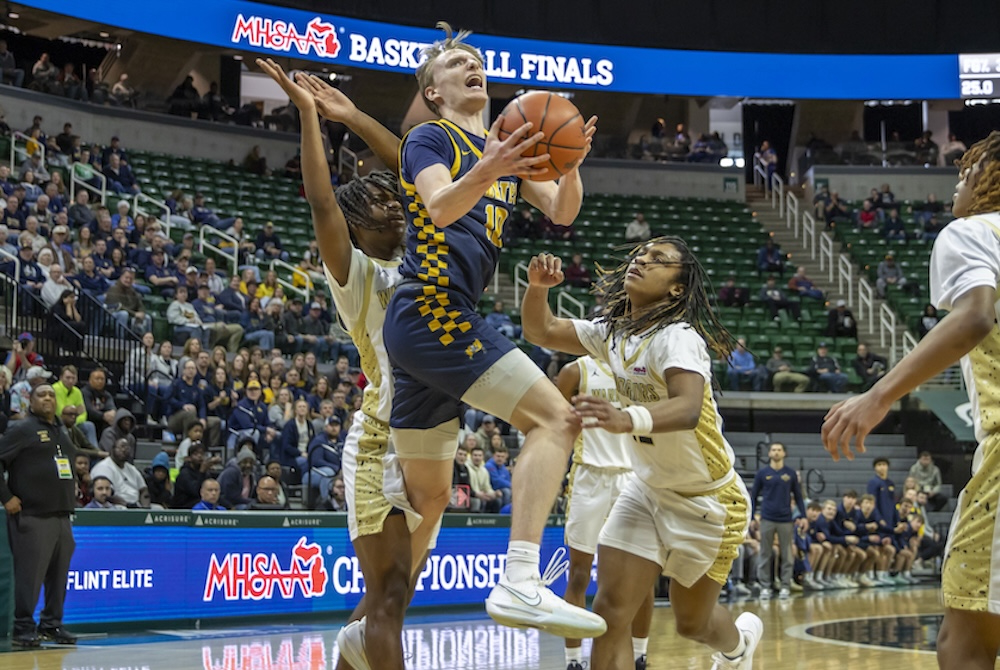 Pewamo-Westphalia’s Grady Eklund (10) drives to the basket while defended by multiple Flint Elite players Thursday at Breslin Center. 