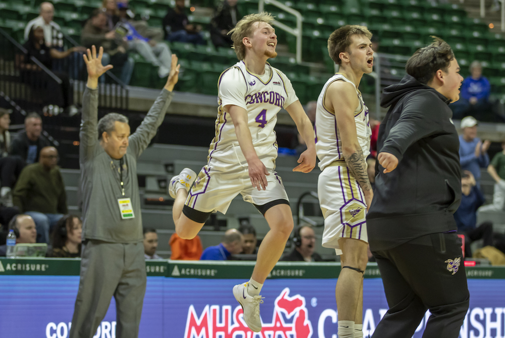 oncord players including Brady Garrett (4) celebrate during the Yellow Jackets’ Division 4 Semifinal win Thursday. 