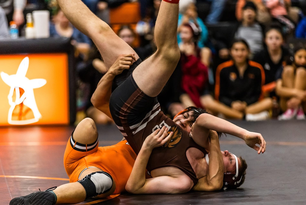 Dowagiac’s Weski Wesaw, in orange, works toward a pin during a tournament this season. 