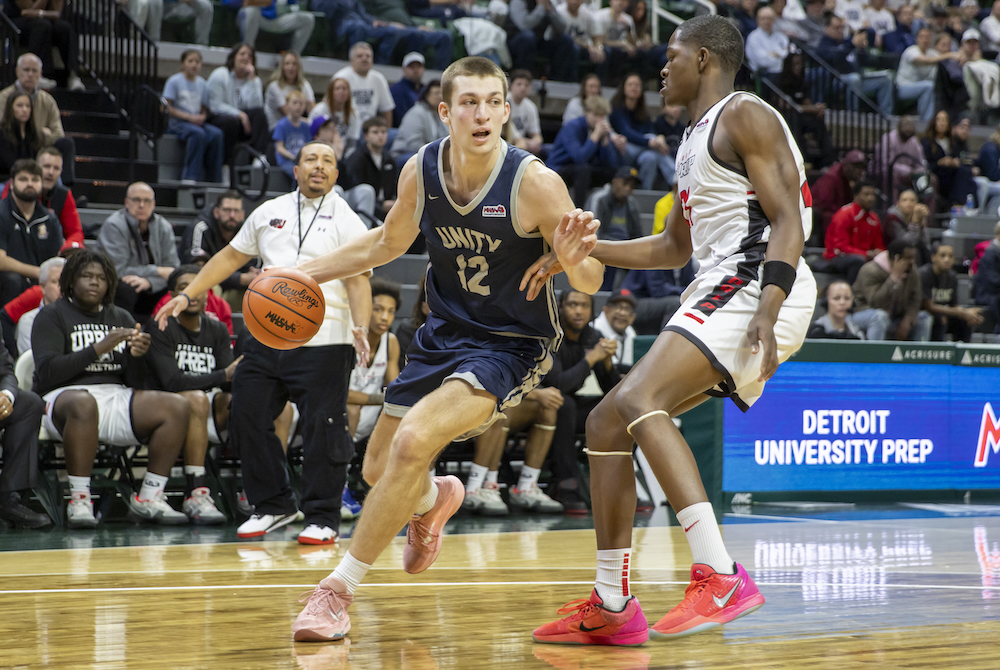 Unity Christian’s Owen VanderWaal (12) makes his move toward the basket during Friday’s Division 2 Semifinal against University Prep. 