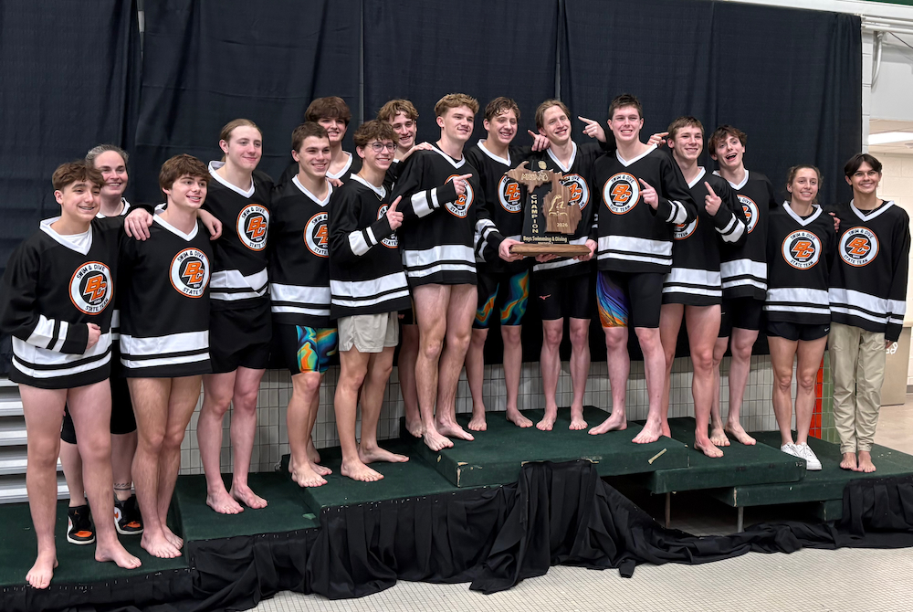 Byron Center stands on the podium with its winning trophy at Eastern Michigan.