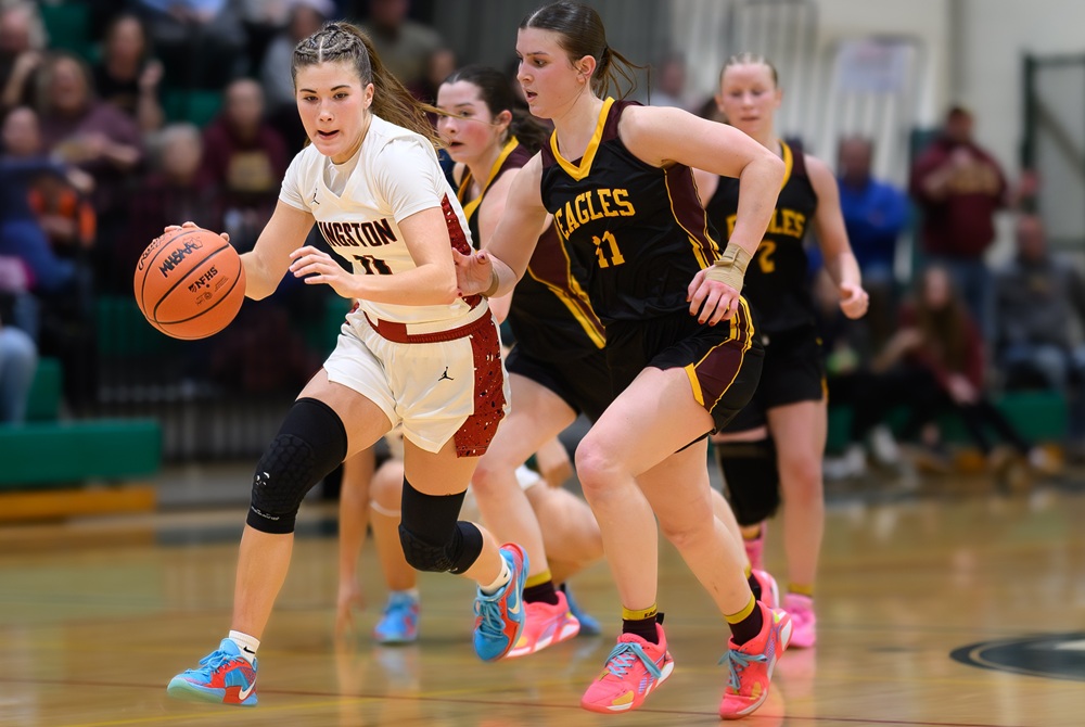 Kingston senior Molly Walker (left) leads a rush up court during her team’s Regional Final victory over Deckerville on Wednesday. 