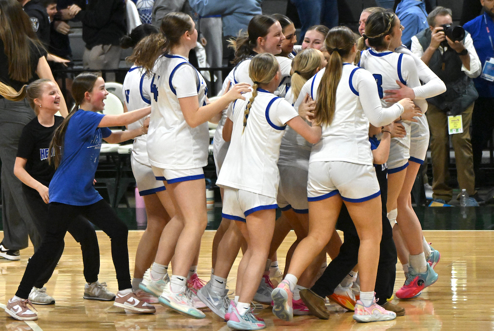 Ishpeming players celebrate their Semifinal win Thursday at Breslin Center. 