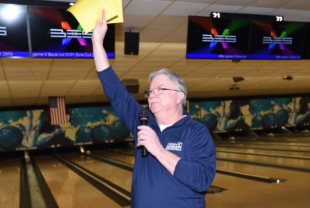 Tom Stockton speaks to the crowd during an MHSAA bowling event.