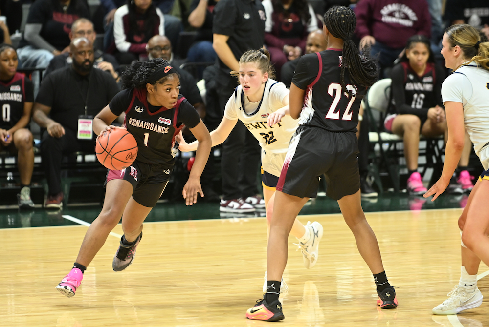 Renaissance’s Maria Walker (1) follows a screen from teammate Jaebri’an Autry (22) during their team’s win over DeWitt on Friday. 