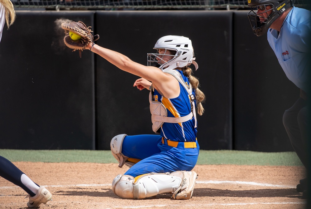 Evart's Allyson Theunick catches a pitch during Evart's championship win in 2024 at Secchia Stadium.
