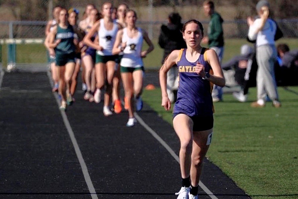 Gaylord's Katie Berkshire leads a track race by a significant distance.