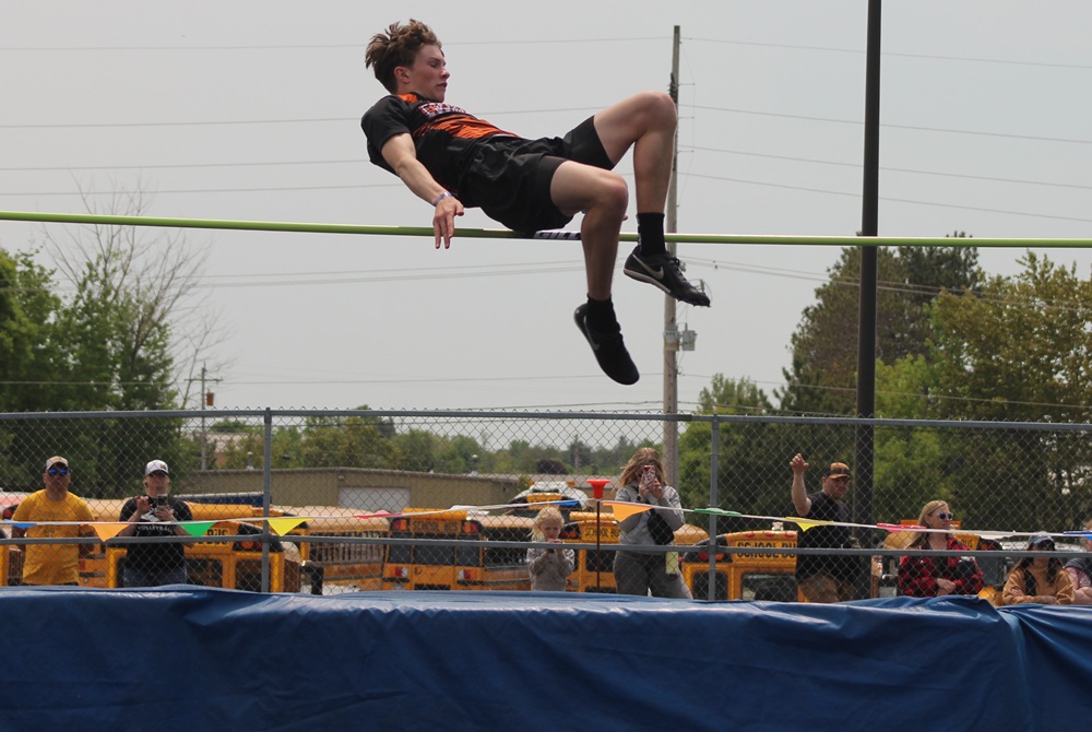  Escanaba’s Andrew Hamlin soars over the high jump bar during a meet. 
