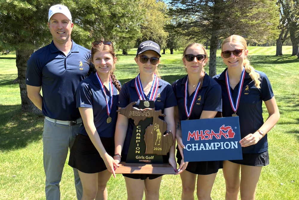 The Bark River-Harris girls golf team poses for a photo Wednesday with its latest championship trophy. 