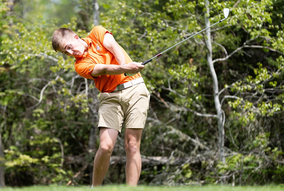 Rock Mid Peninsula's Christian VanDamme rips through an iron shot during Wednesday’s Upper Peninsula Division 3 Final. 