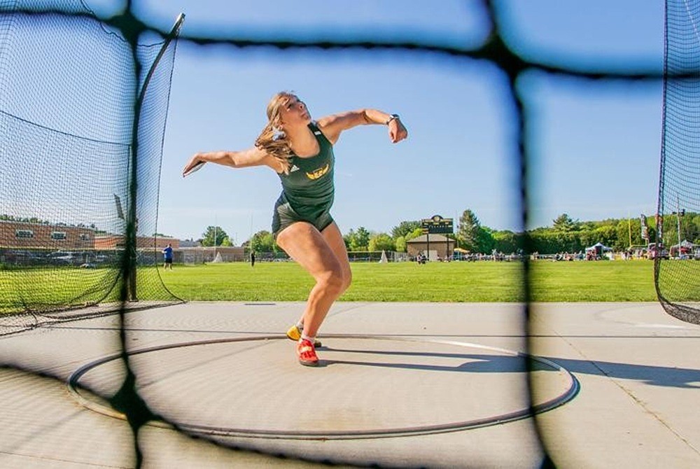 Traverse City Central’s Loralei Zielinski winds up during a discus throw.
