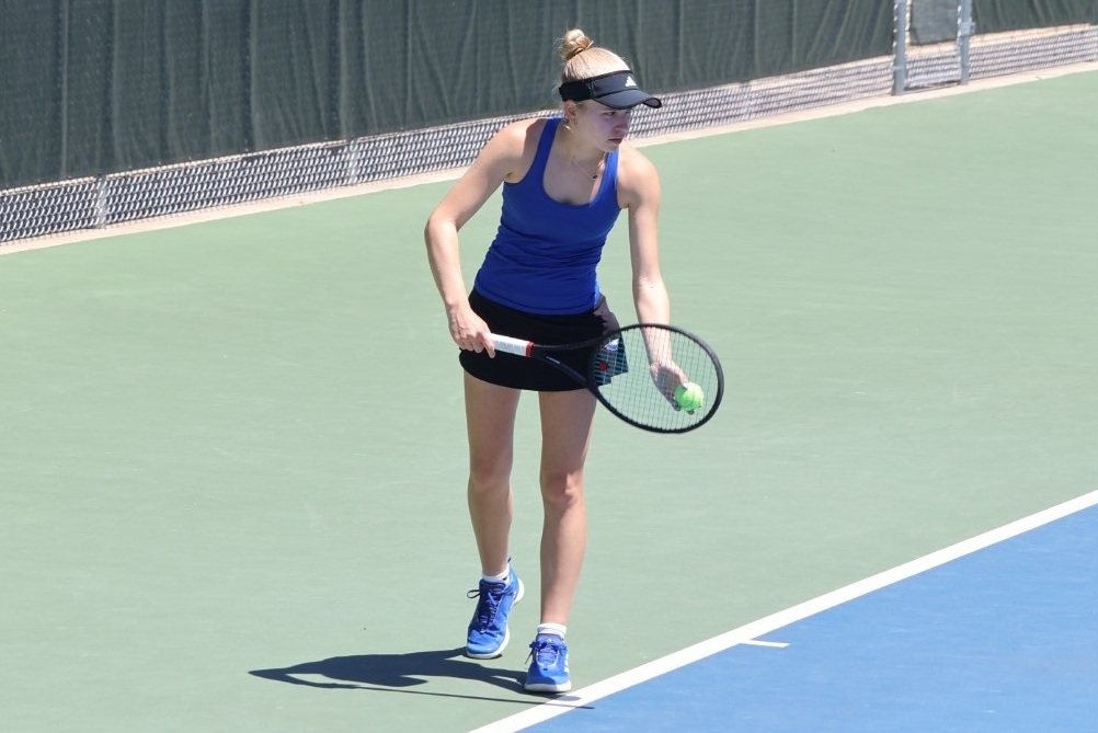 Utica Eisenhower's Morgan Emerick prepares to serve during the MHSAA Finals.