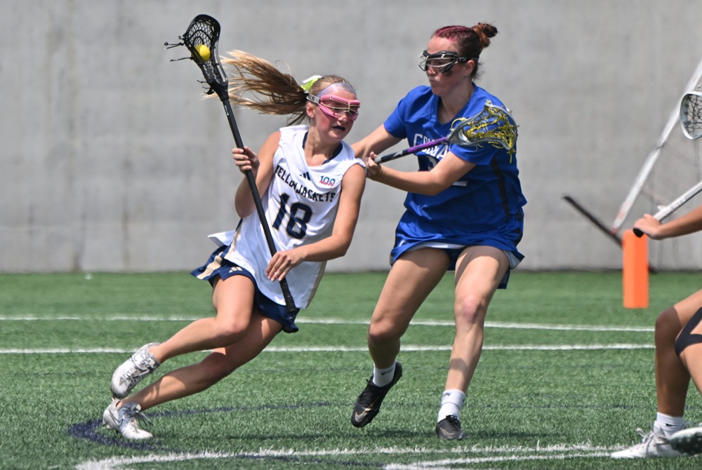 Detroit Country Day’s Charlotte Cook (18) attempts to get past a Grand Rapids Catholic Central defender during last season’s Division 2 Final