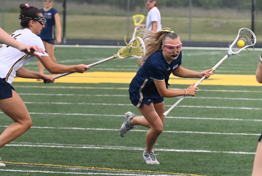 Detroit Country Day’s Charlotte Cook makes a move while directing the offense during Friday’s Division 2 Final.
