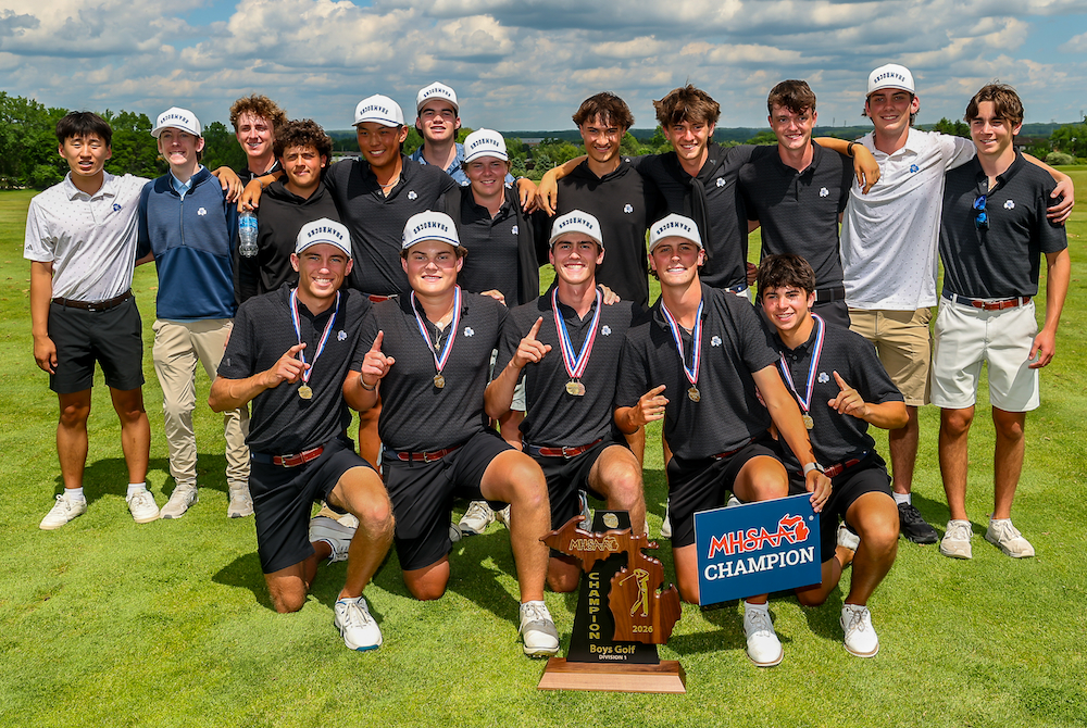 Detroit Catholic Central’s golf team poses for a photo after completing its championship victory Saturday.