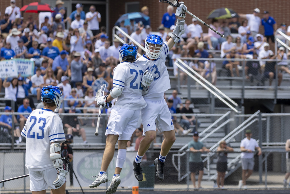 Detroit Catholic Central’s Luke Kramer (22) and Peyton Sofran (3) celebrate during their team’s Division 1 championship game Saturday. 
