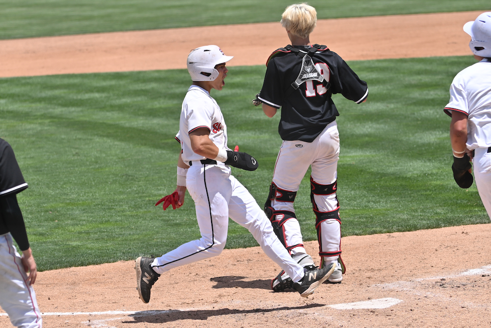 An Orchard Lake St. Mary’s runner crosses the plate during the Eaglets’ Division 2 Semifinal win Thursday at McLane Stadium.