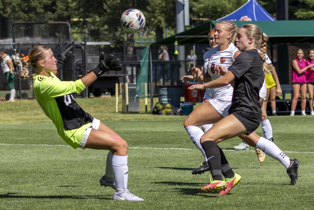 Rockford goalkeeper Kaia Slanger, far left, makes a stop as Troy and Rockford players pursue the ball Friday at DeMartin Stadium.