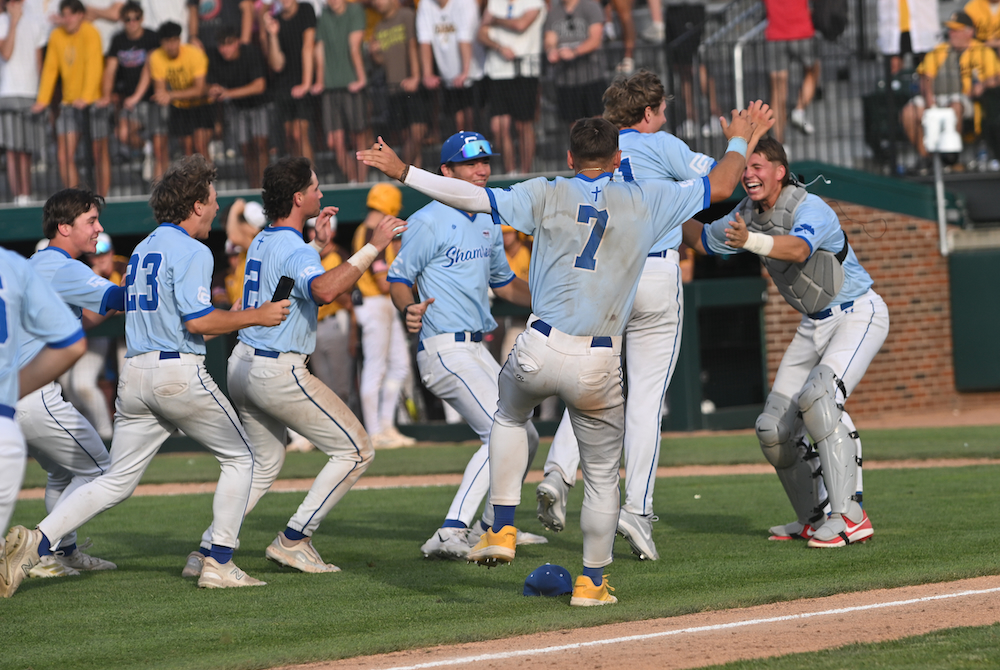 Detroit Catholic Central players celebrate after clinching the Division 1 title Saturday at McLane Stadium. 