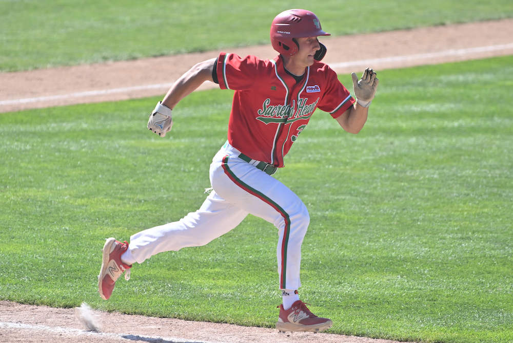 Sacred Heart's Noah Zeien (3) sprints to first base during the Division 4 Final on Saturday.