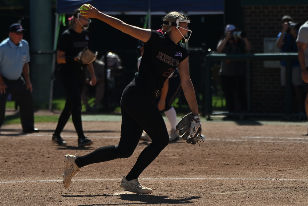 Walled Lake Northern's Lyla Turmell makes her move toward the plate while pitching at the Division 1 Final.