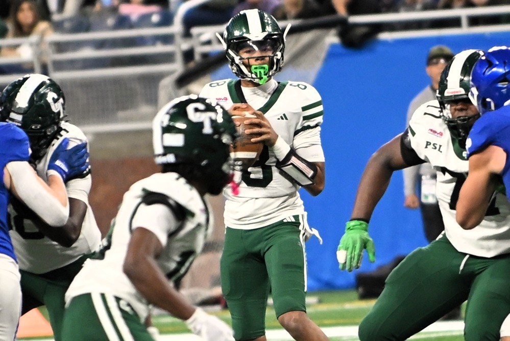Cass Tech quarterback Donald Tabron (8) drops back to pass during last season’s Division 1 Final, moments before throwing for a big gain that set up the team’s first touchdown.