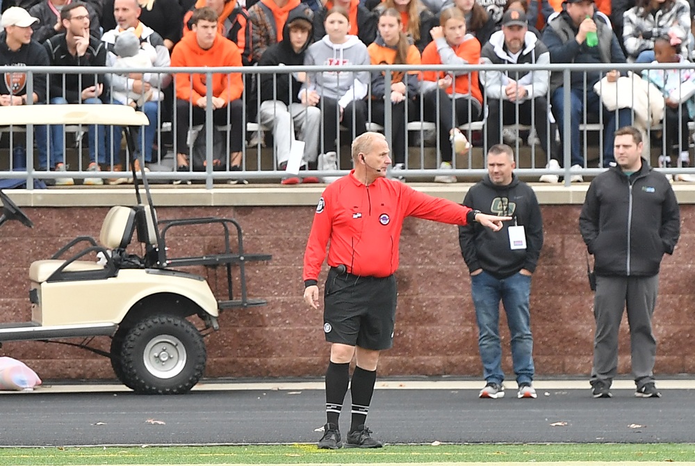 An official points during an MHSAA Boys Soccer Final. 