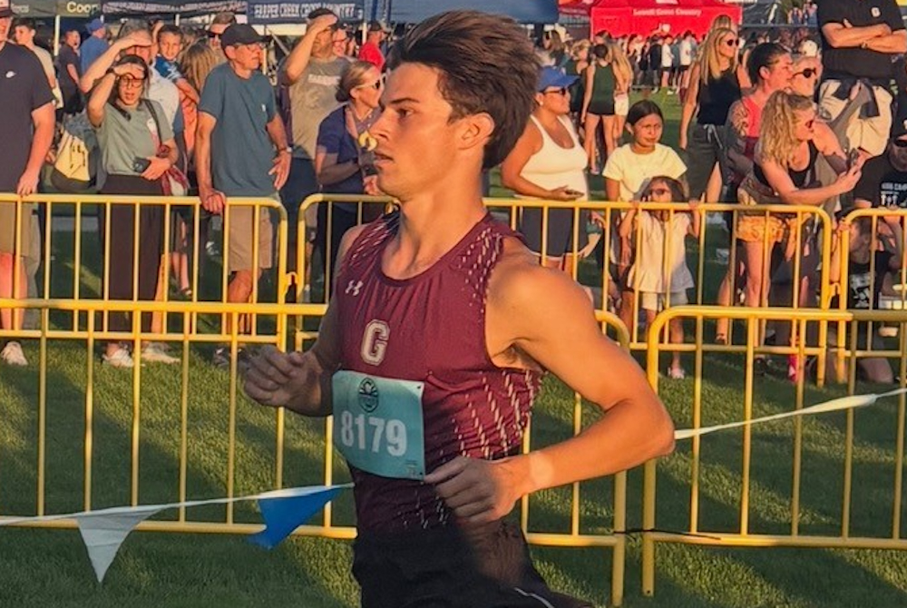 Caden Livermore runs in a cross country race. 