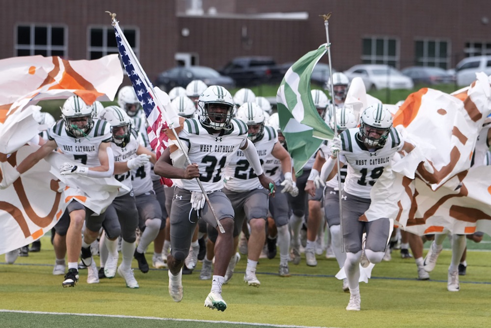 Grand Rapids West Catholic takes the field prior to last week's win over Forest Hills Eastern.