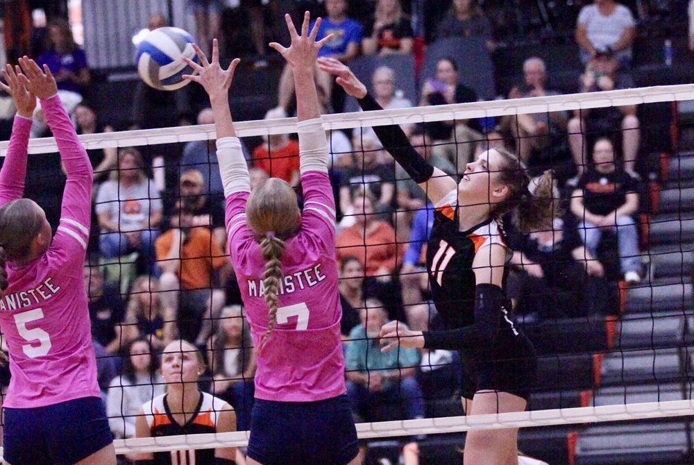 Jenna Middleton attempts a kill against Manistee.