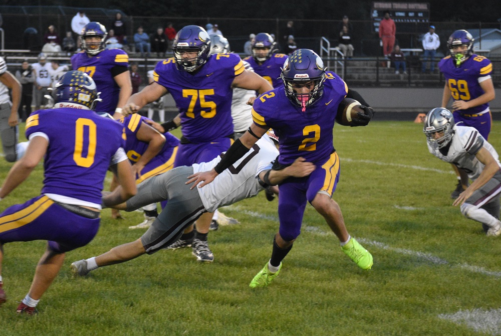 Bronson senior tailback Ben Stevens (2) works to break a tackle against Buchanan on Sept. 25.