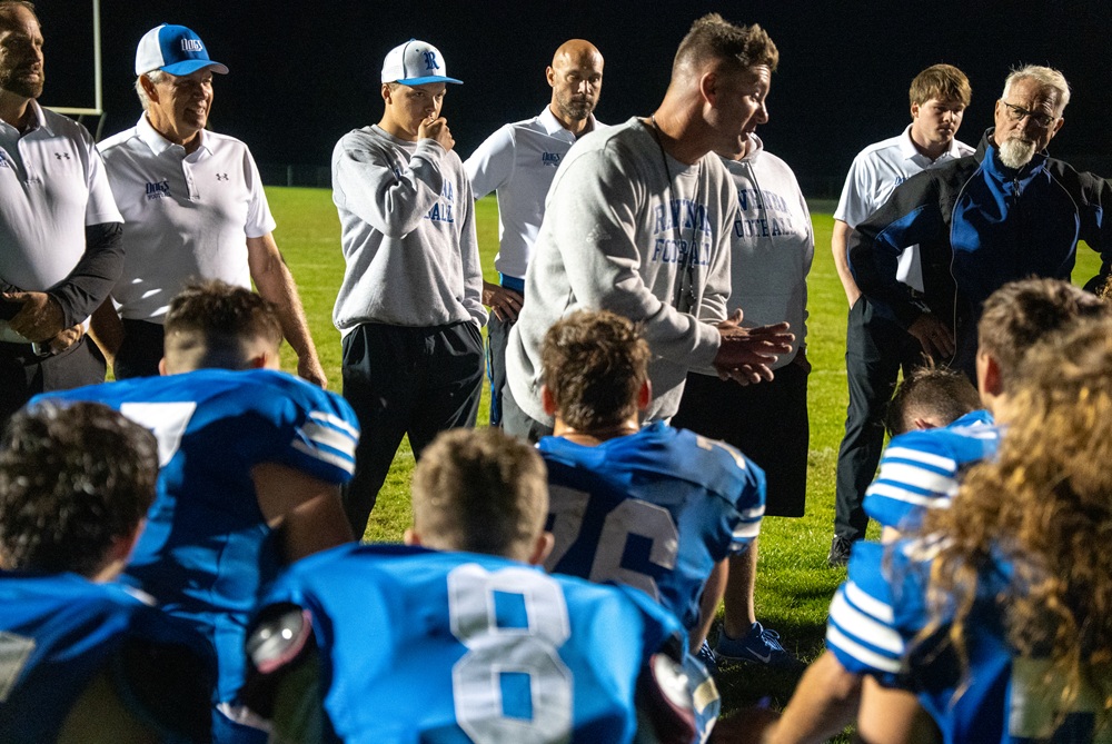 Ravenna head coach Steve Czerwon addresses the team following a 28-14 victory over Shelby on Sept. 25.