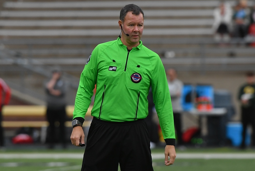 This soccer official is monitoring the action during a 2022 MHSAA Boys Soccer Final.