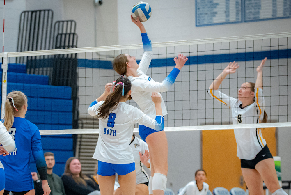 A Bath hitter puts the ball over the net during a match against Lansing Christian this season.
