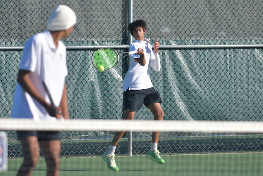 ackson Lumen Christi's Shayan Challapalli hammers a forehand during his and partner Gurmilan Singh's championship match Thursday at No. 4 doubles.