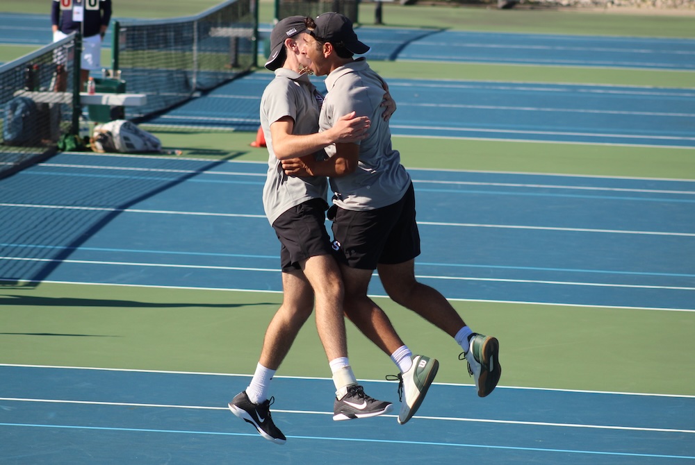 Birmingham Seaholm’s Kalil Wahab and Hunter Helfman celebrate their championship at No. 1 doubles Saturday at Midland Tennis Center. 