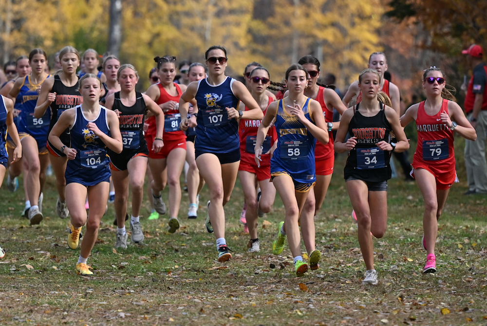 Runners take off at the start of the Upper Peninsula Division 1 Final on Saturday on the Michigan Tech Nordic Ski Trails.