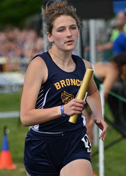 Julia Olson runs a leg of the 1,600 relay for Bark River-Harris this past spring at the UPD2 Track & Field Finals. 