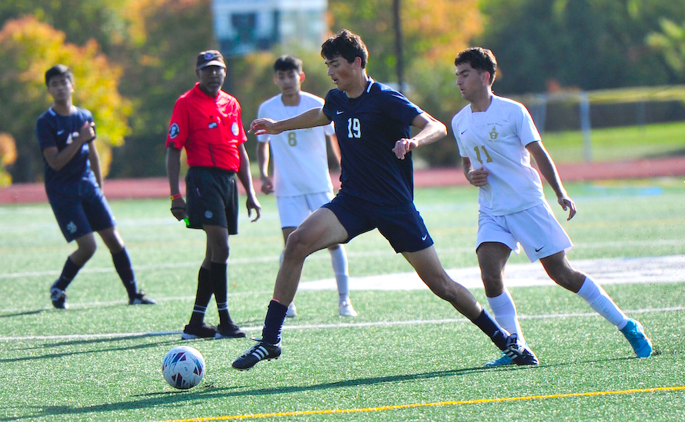 Greenhills' Raj Tiller gets a foot on the ball during his team's game against Monroe St. Mary.