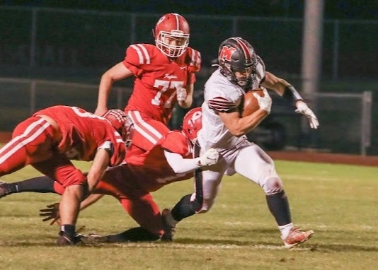 Haisenleder works to break a tackle during a Week 8 win over Whitmore Lake. 